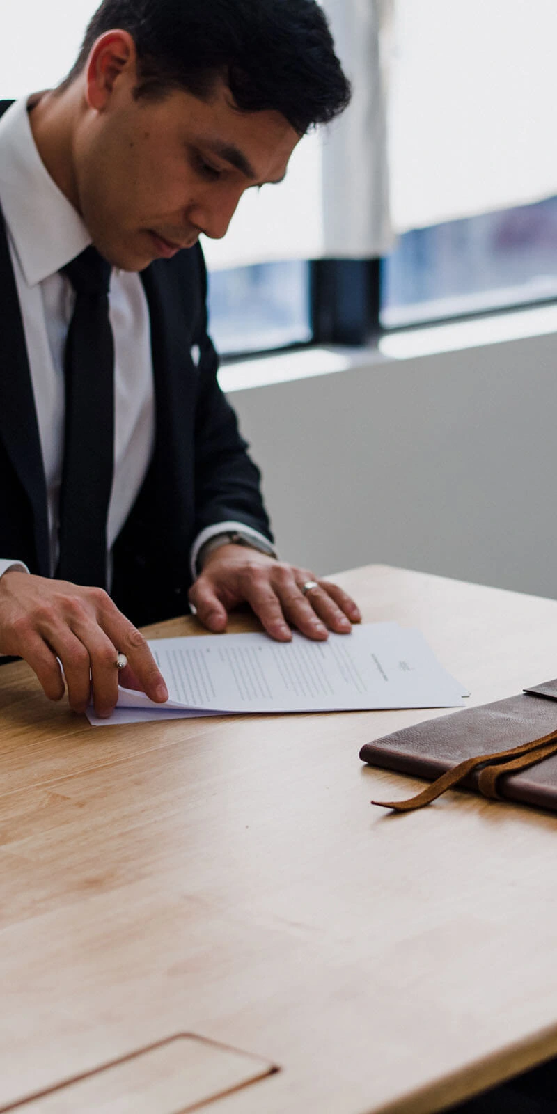 Attorney reviewing a legal document, representing Aprolasa’s dedication to helping employers navigate labour law complexities.